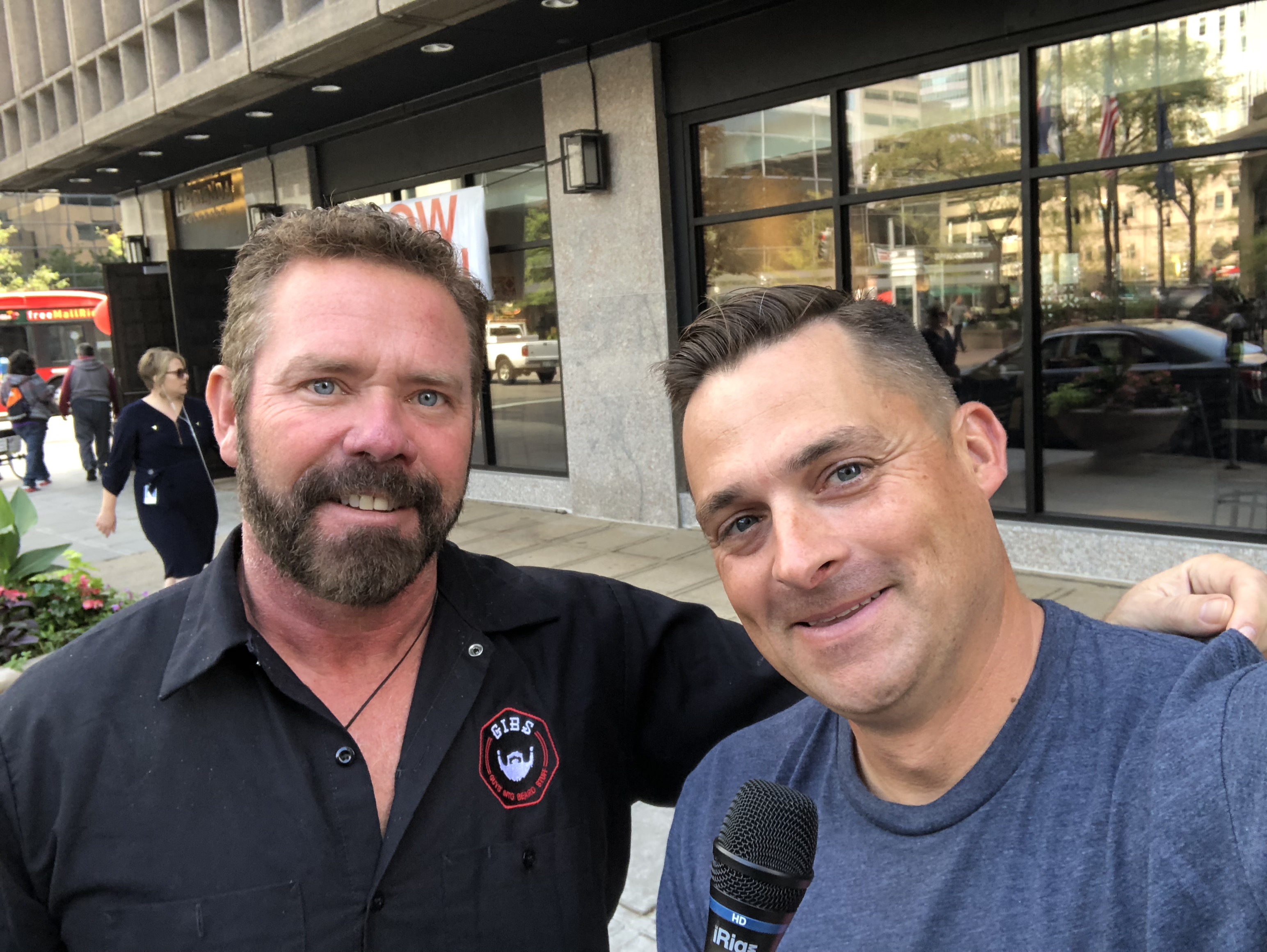Chad Jordan and Gib holding a mic